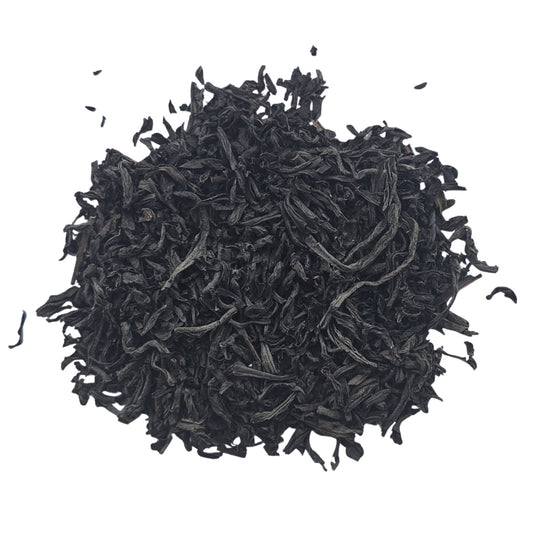 Loose leaf Ceylon black tea on a white background